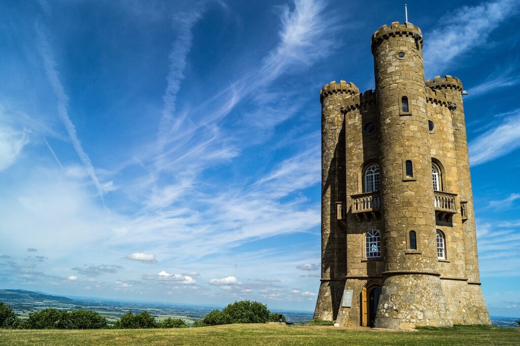 Broadway Tower in warm sunshine, with the Vale of Evesham beyond.